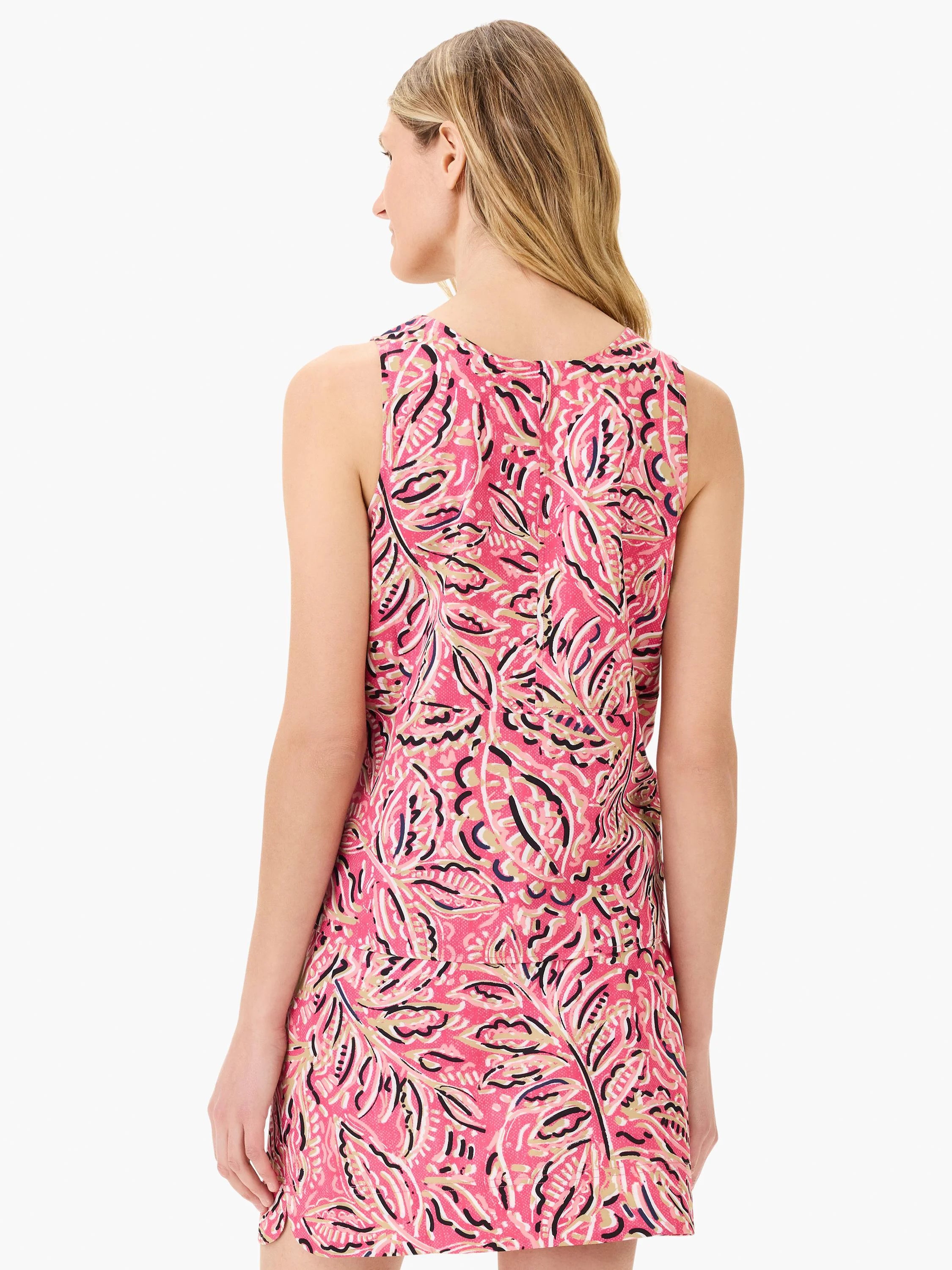 Pink sleeveless tank top with a floral pattern in pink, beige, and navy. Back view.