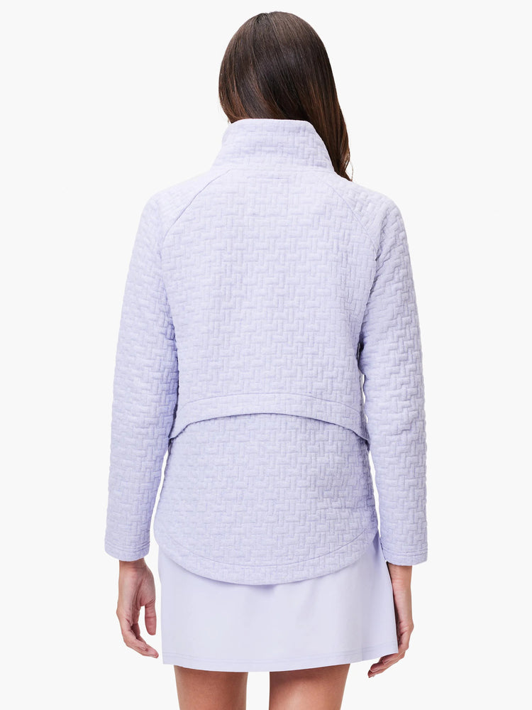 Lilac quilted jacket, long sleeves, mock neck.  Textured woven pattern. Shown from the back.