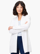 Off-white open-front cardigan with long sleeves, shown on model.  The cardigan has a slightly textured appearance.