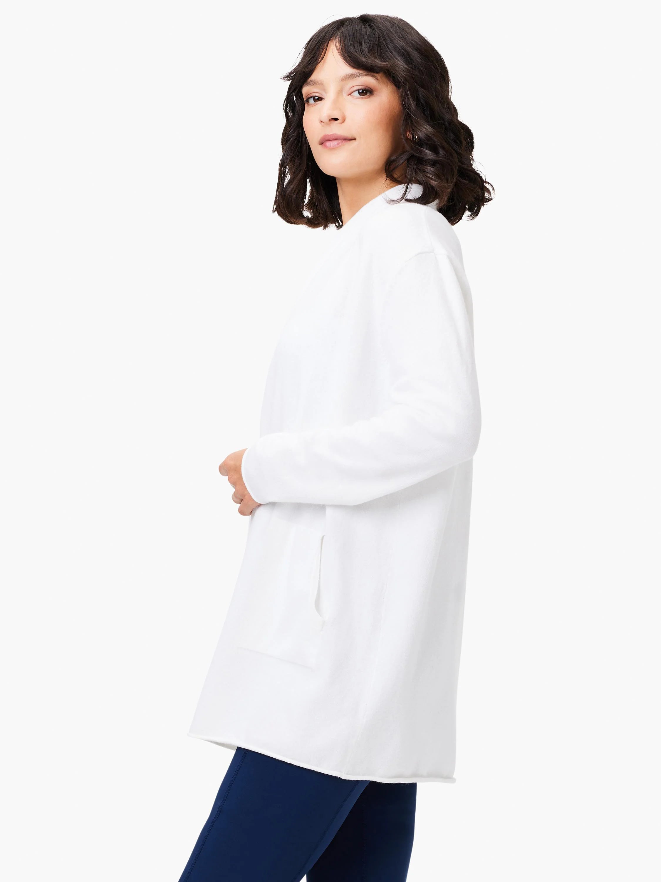 White open-front cardigan, long sleeves, hip-length, single patch pocket.