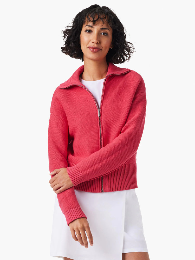 Pink zip-front sweater jacket;  ribbed cuffs and hem.  The zipper is visible.