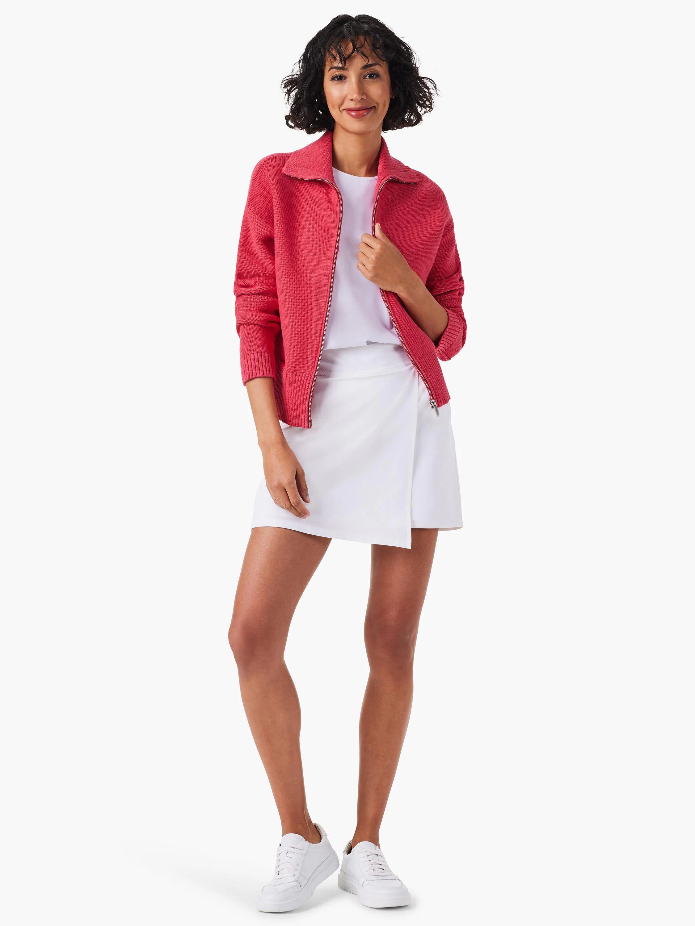 Pink zip-front sweater jacket, cropped.  Features ribbed cuffs and hem.