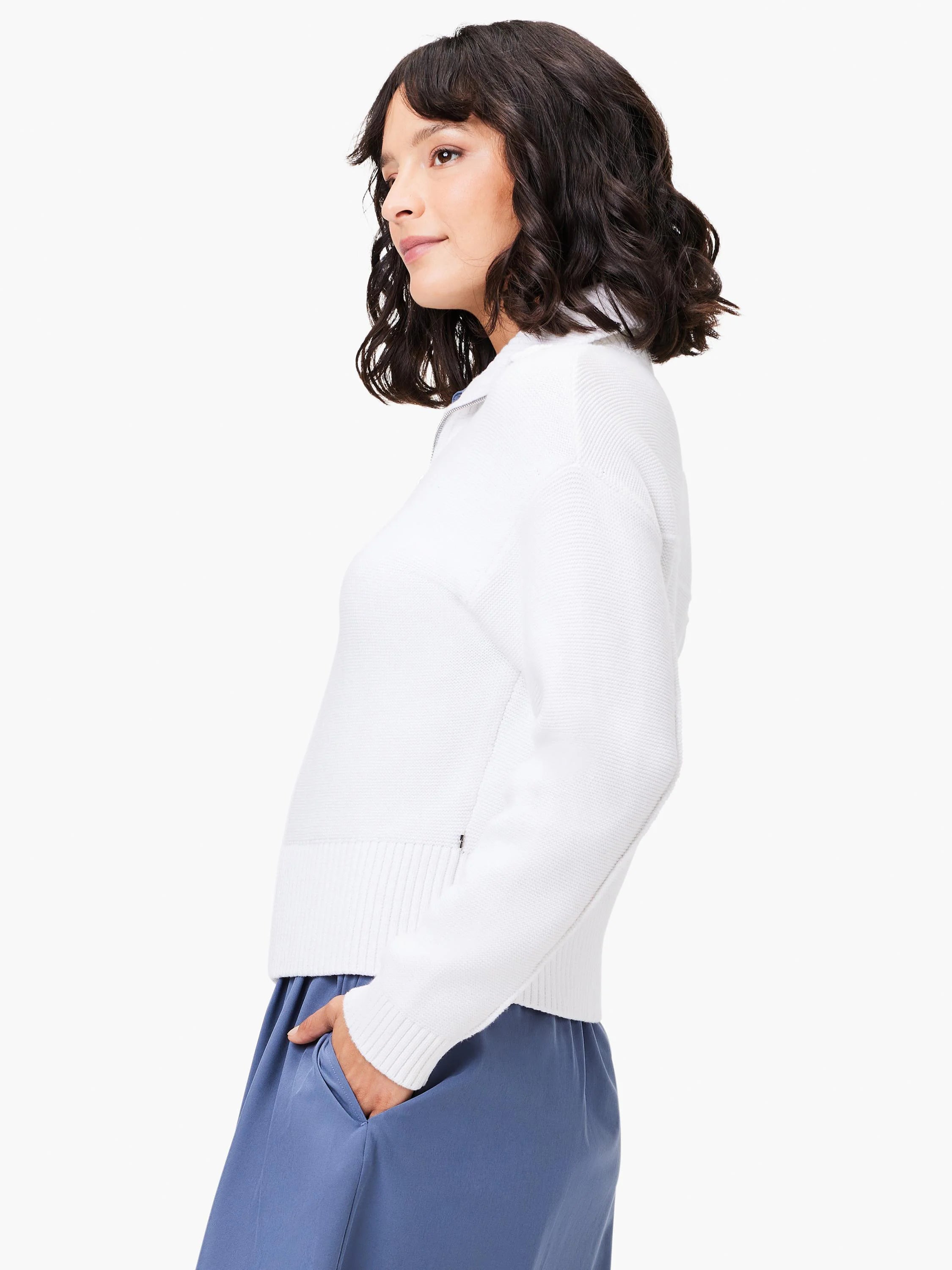 White zip-front sweater jacket.  Long sleeves, ribbed trim.