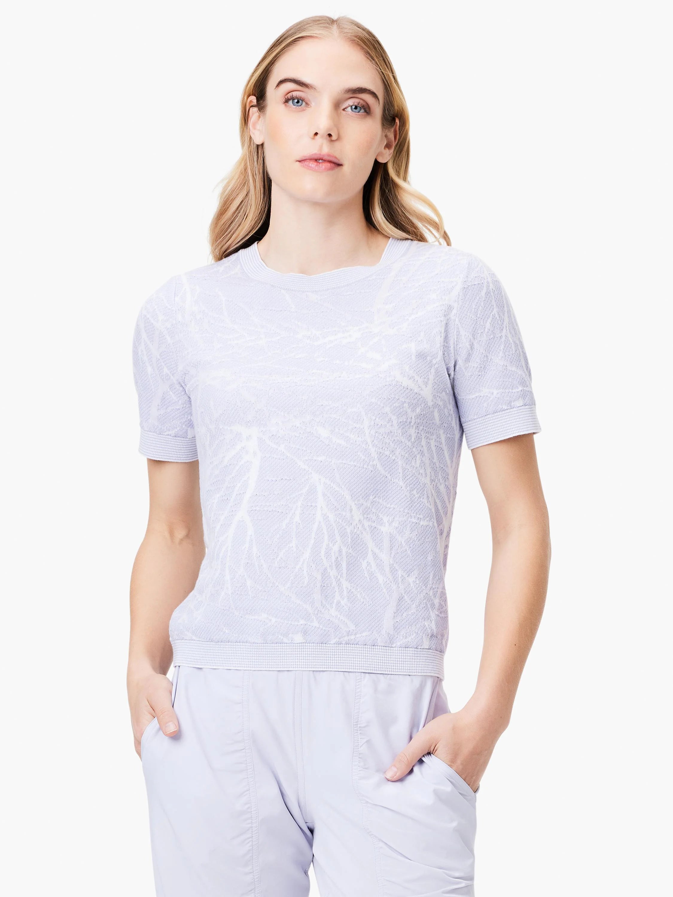 Light lavender short-sleeved sweater tee with a textured, lighter lavender leaf pattern.  Crew neck.