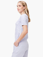 Lavender short-sleeve sweater tee with a textured, branch-like pattern.