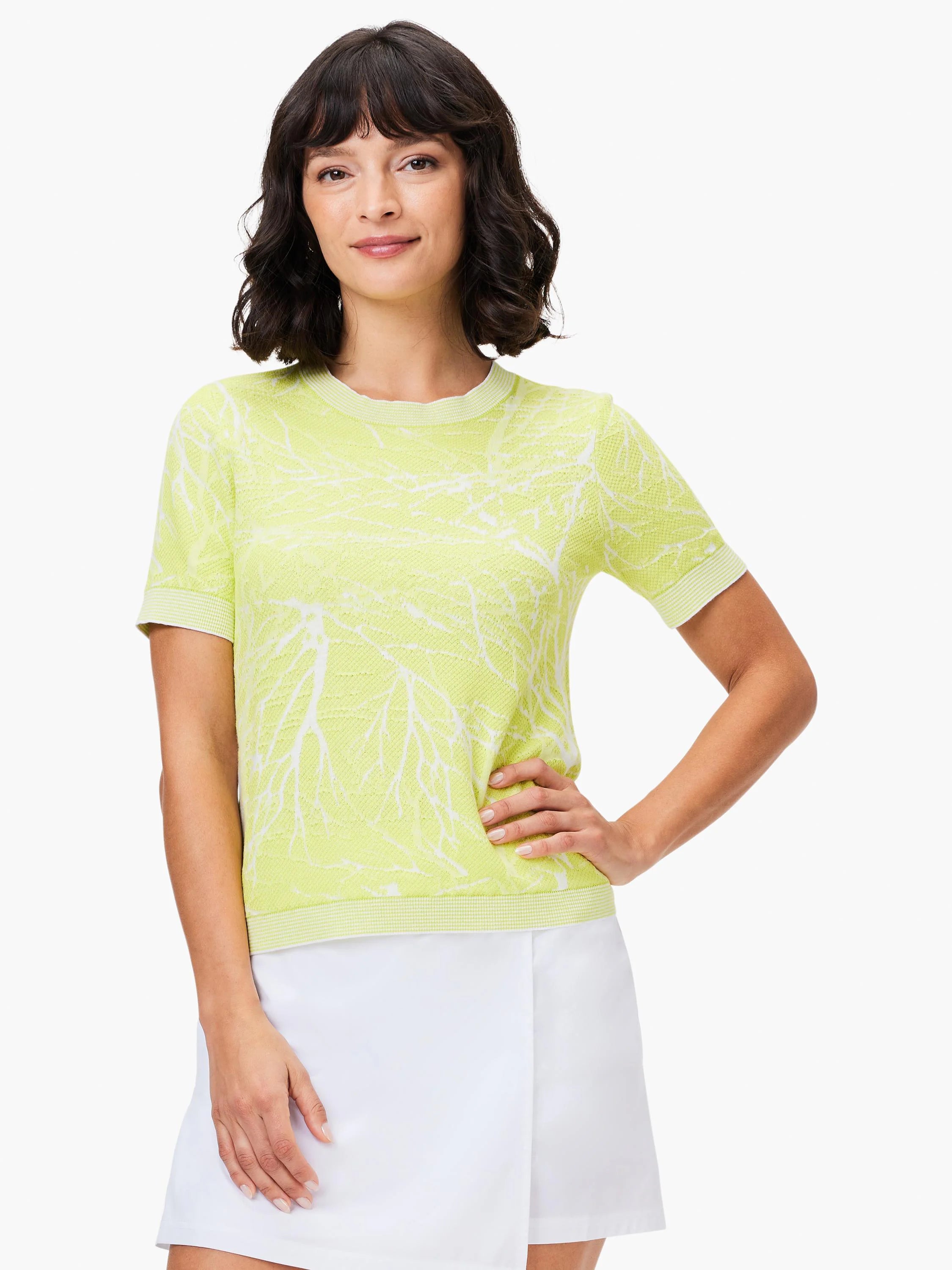 Lime green short-sleeved knit sweater tee with a white, tree branch pattern.  Crew neck.