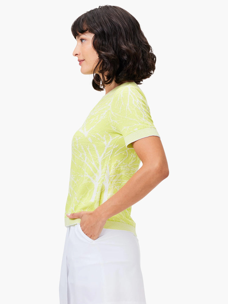 Lime green short-sleeve sweater tee with white tree branch pattern.  Crew neck.
