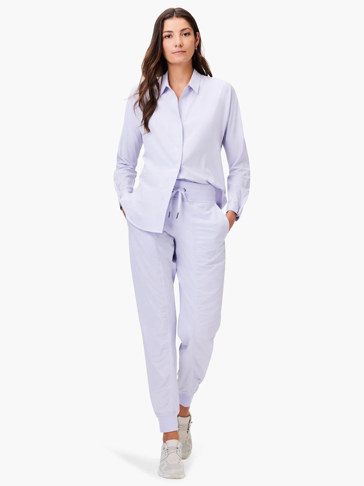 Light purple button-down shirt with collar and long cuffed sleeves. The fabric appears soft and flexible.