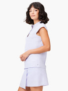 Lavender sleeveless snap-neck top and matching skirt.  Small logo on shirt.
