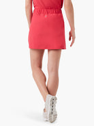 Red mini skort; elasticized waistband; rear view.