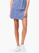 Dusty blue skort with a side slit, shown on a model.