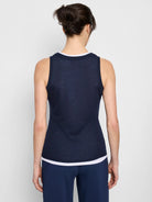 Here's alt text for the image, following the guidelines:

Navy blue sleeveless top, double layered with a thin white band...