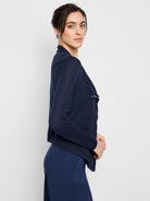 Navy blue gauzy cardigan, long sleeves, snap front, draped neckline.