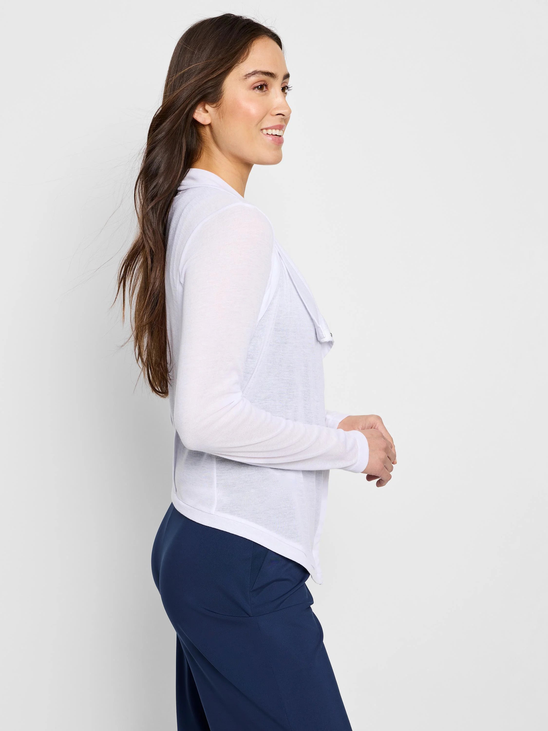 White gauzy cardigan, long sleeves, snap front, open drape.