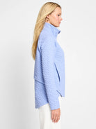 Light blue quilted jacket, half-zip closure.  Textured fabric.