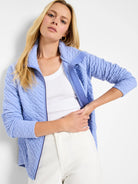 Periwinkle blue quilted zip-up jacket.  Diamond pattern quilting.  Slightly textured fabric.