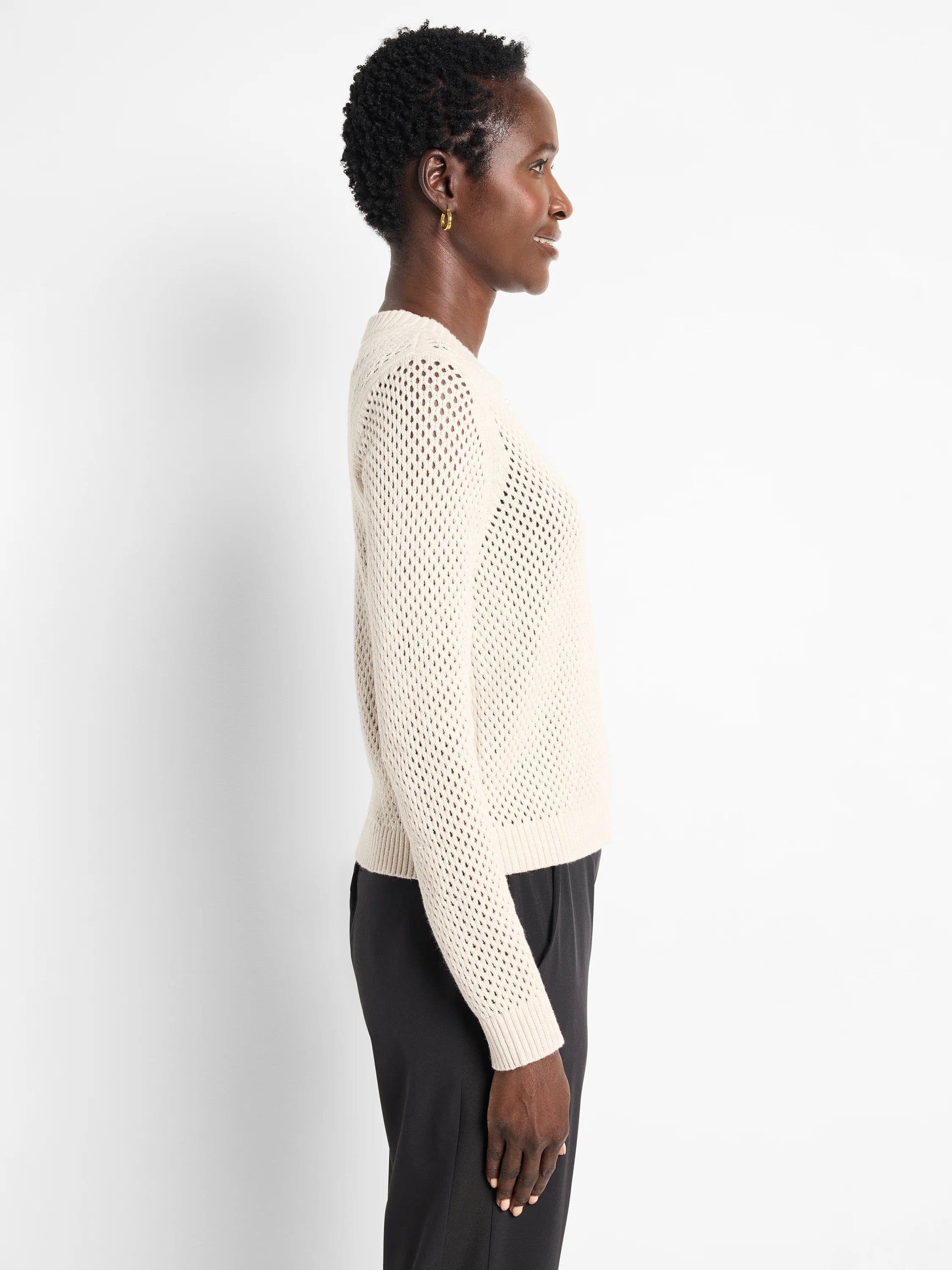 Off-white zip-front mesh cardigan.  Long sleeves, open knit.