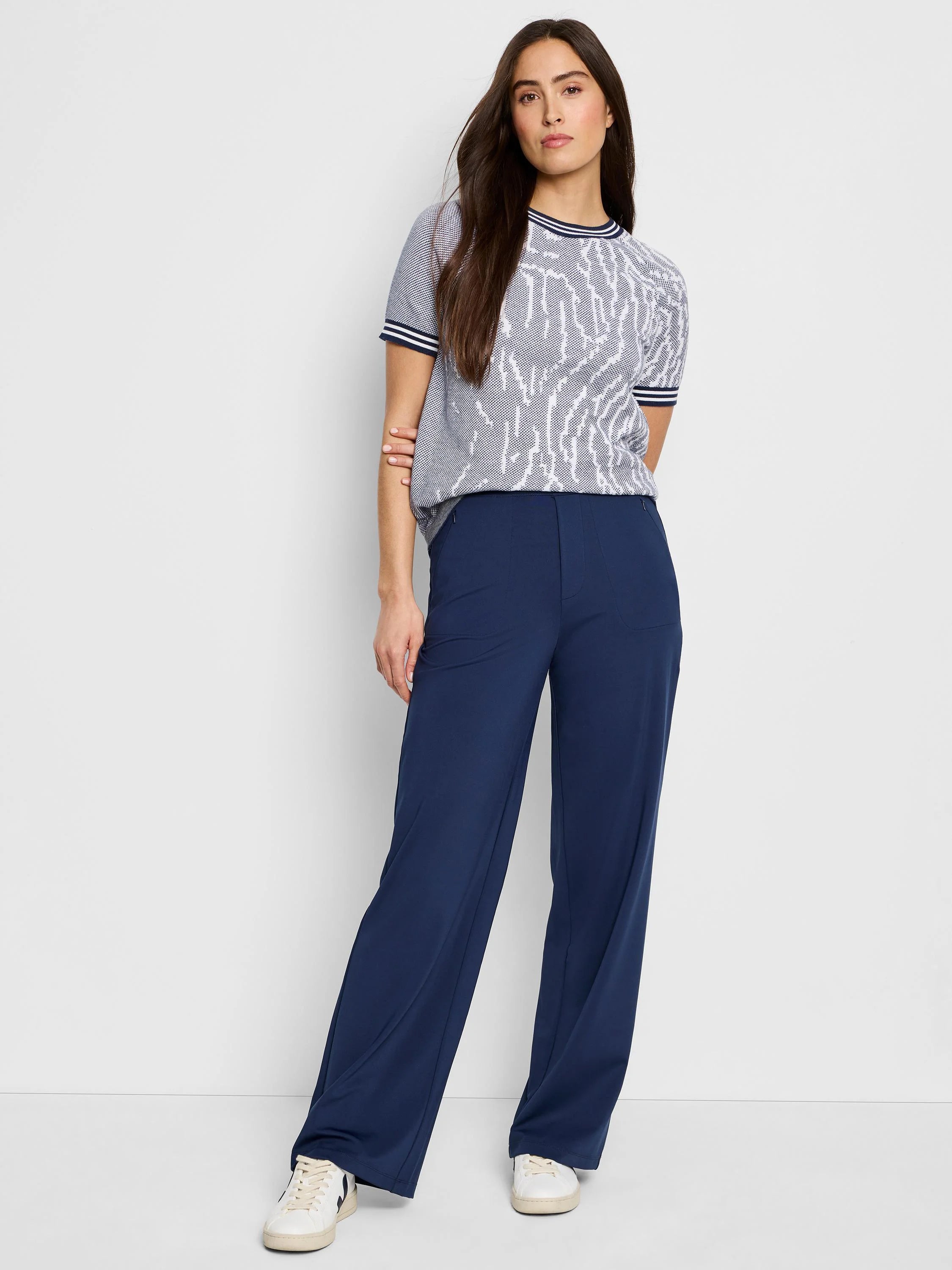 Gray short-sleeved sweater tee with white and navy jacquard pattern.  Navy pants.