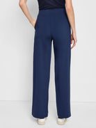 Here's alt text for the image, under 125 characters:

"Navy blue wide-leg pants, pull-on style, seen from behind.  The...