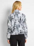 White popover with black abstract brushstroke pattern.  Long sleeves, banded cuffs and hem.