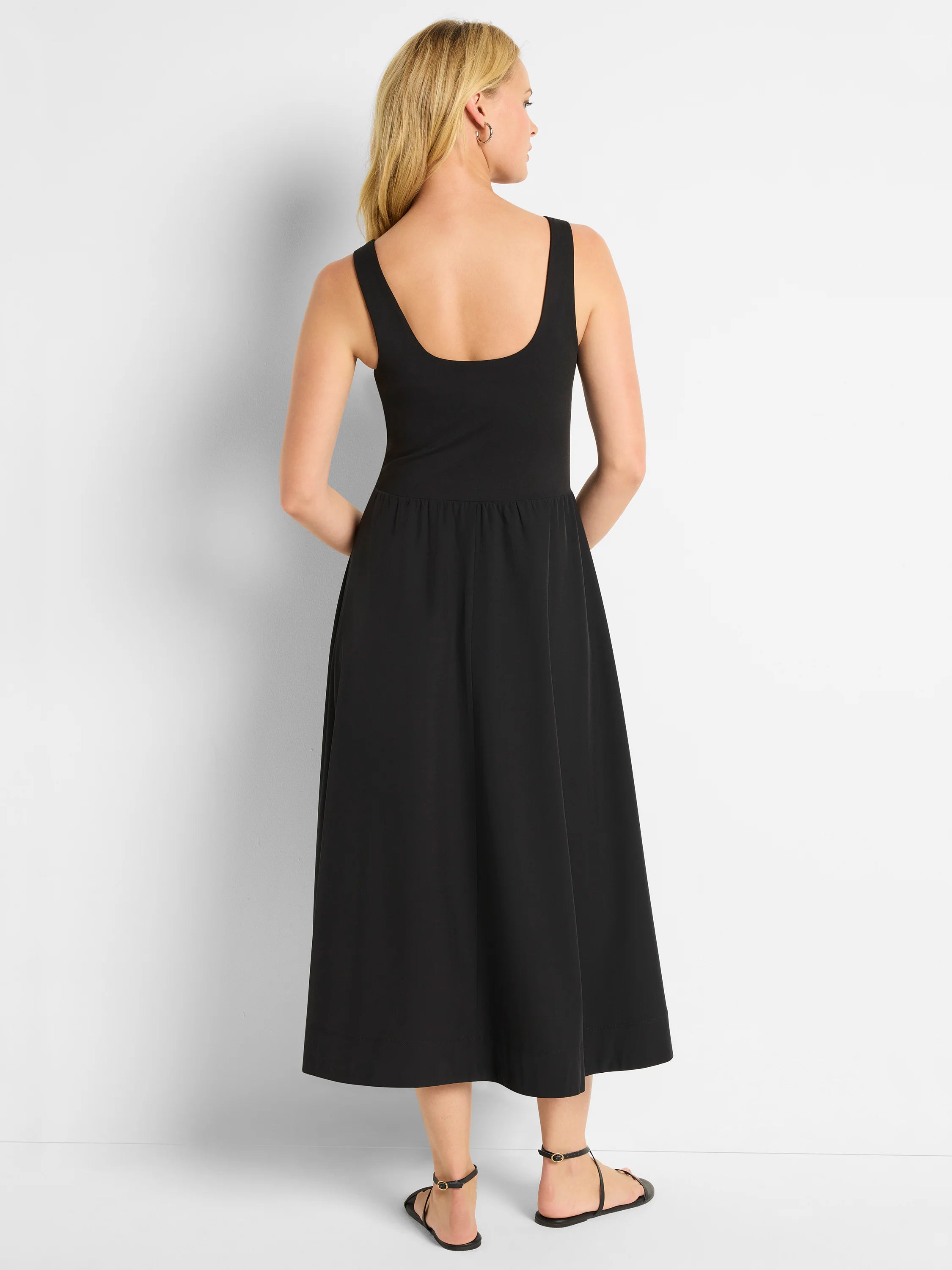 Black midi dress; sleeveless, square neck, fitted bodice, flared skirt.