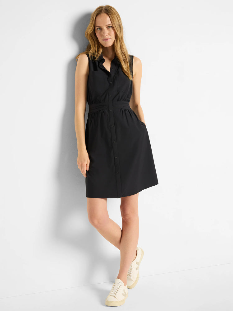 Black sleeveless shirt dress with buttons, pockets, and fitted waist.  Model wears off-white sneakers.