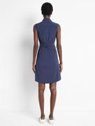 Navy blue, sleeveless, collared dress; cinched waist; above-knee length.