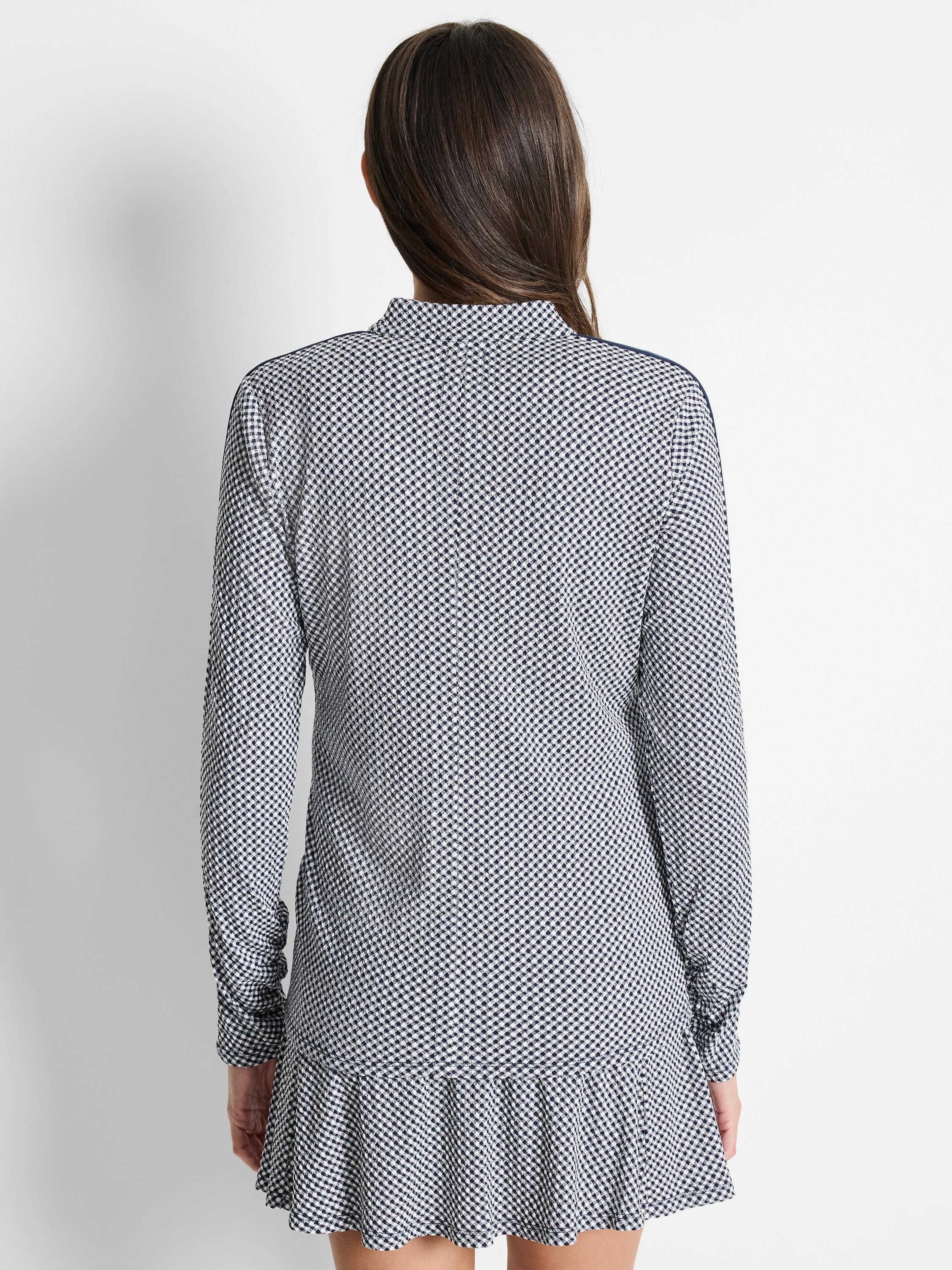 White and navy gingham long-sleeve jacket with ruffle hem.  Back view.