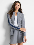 Gingham jacket in navy and white.  Features navy side stripes and zipper closure.