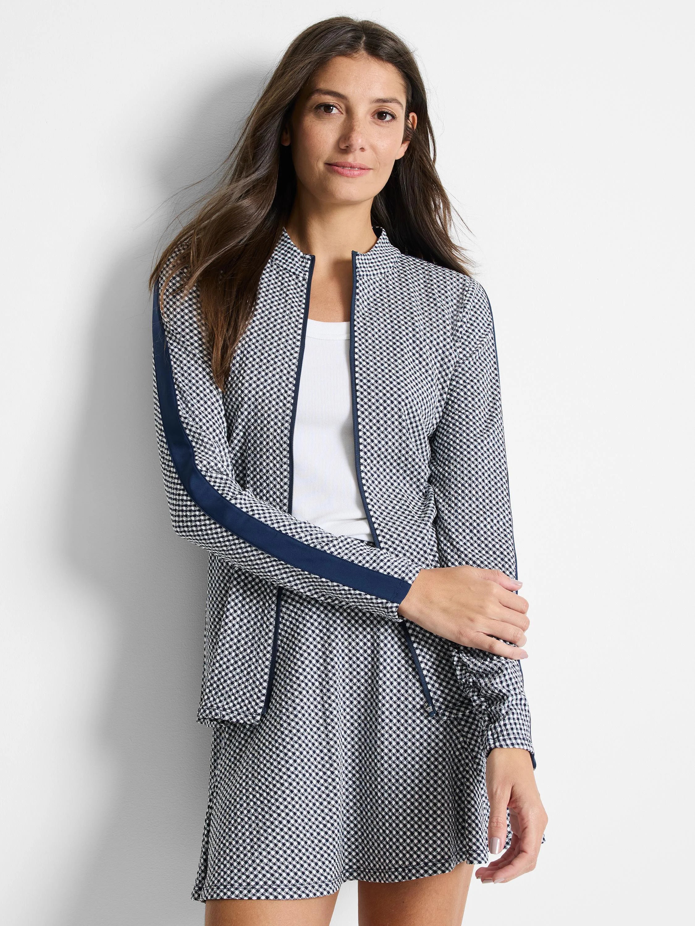 Gingham jacket in navy and white.  Features navy side stripes and zipper closure.