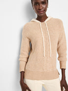 Beige cable-knit hooded sweater with off-white drawstrings.  Ribbed cuffs and hem.