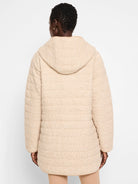 Beige hooded quilted coat.  Horizontal quilting, long sleeves.  Reverse side not visible.
