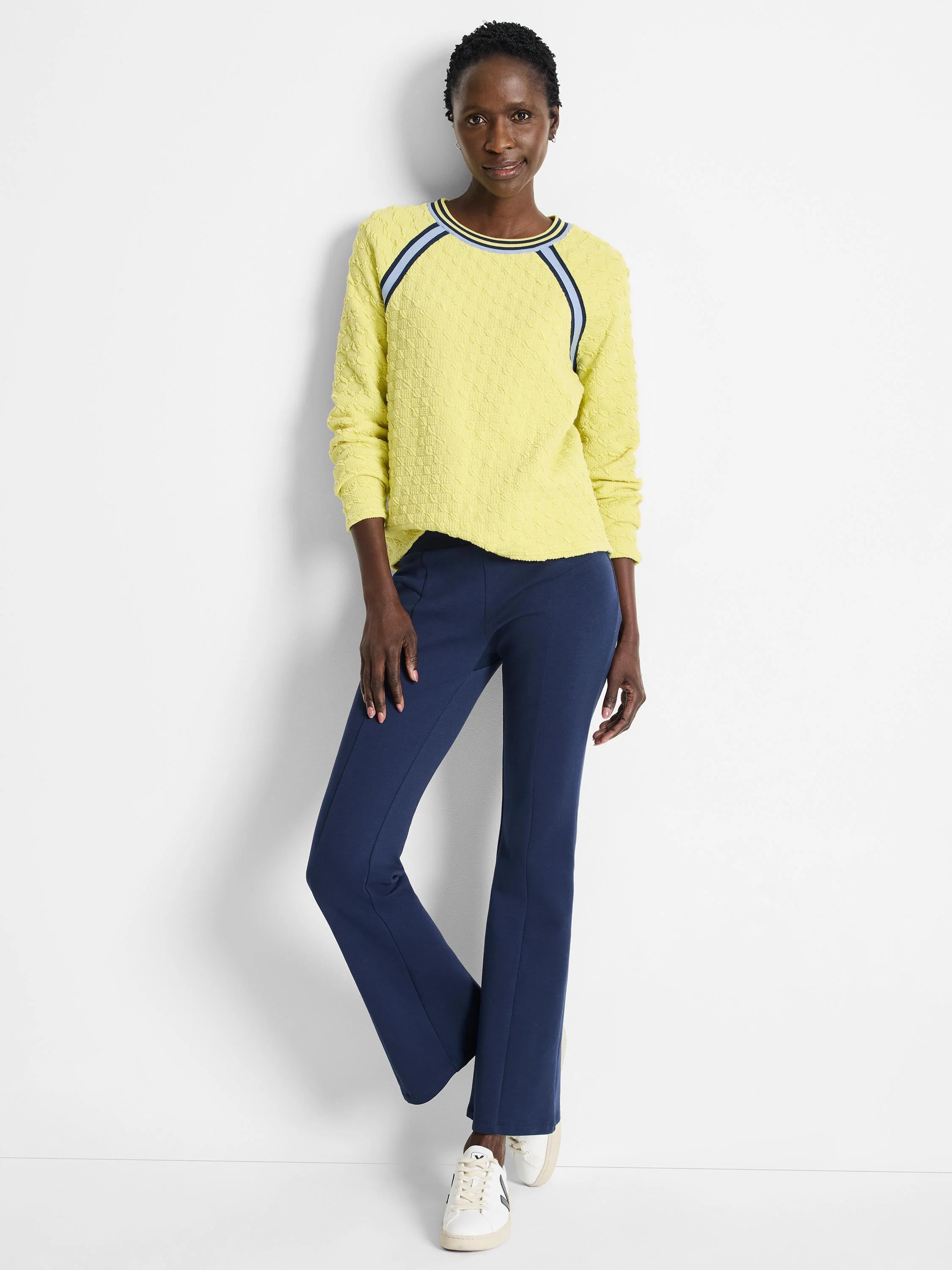 Pale yellow textured pullover sweater with navy blue and light blue shoulder stripes.