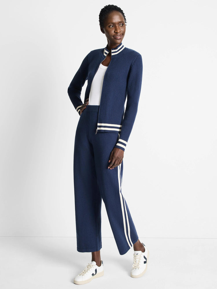 Navy blue wide-leg pants with off-white side stripes.