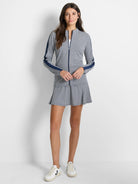 White and navy gingham skort;  A-line silhouette.  Navy side panels on matching jacket.