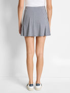 Here's alt text for the image, under 125 characters:

"A-line skort in navy and white gingham.  Shown from the back.