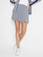 White and navy gingham print skort; A-line shape, mid-thigh length.