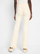 Off-white bootcut pants with back pockets.  High-waisted.