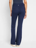 Dark navy blue bootcut pants; back view shows a waistband and two back pockets.