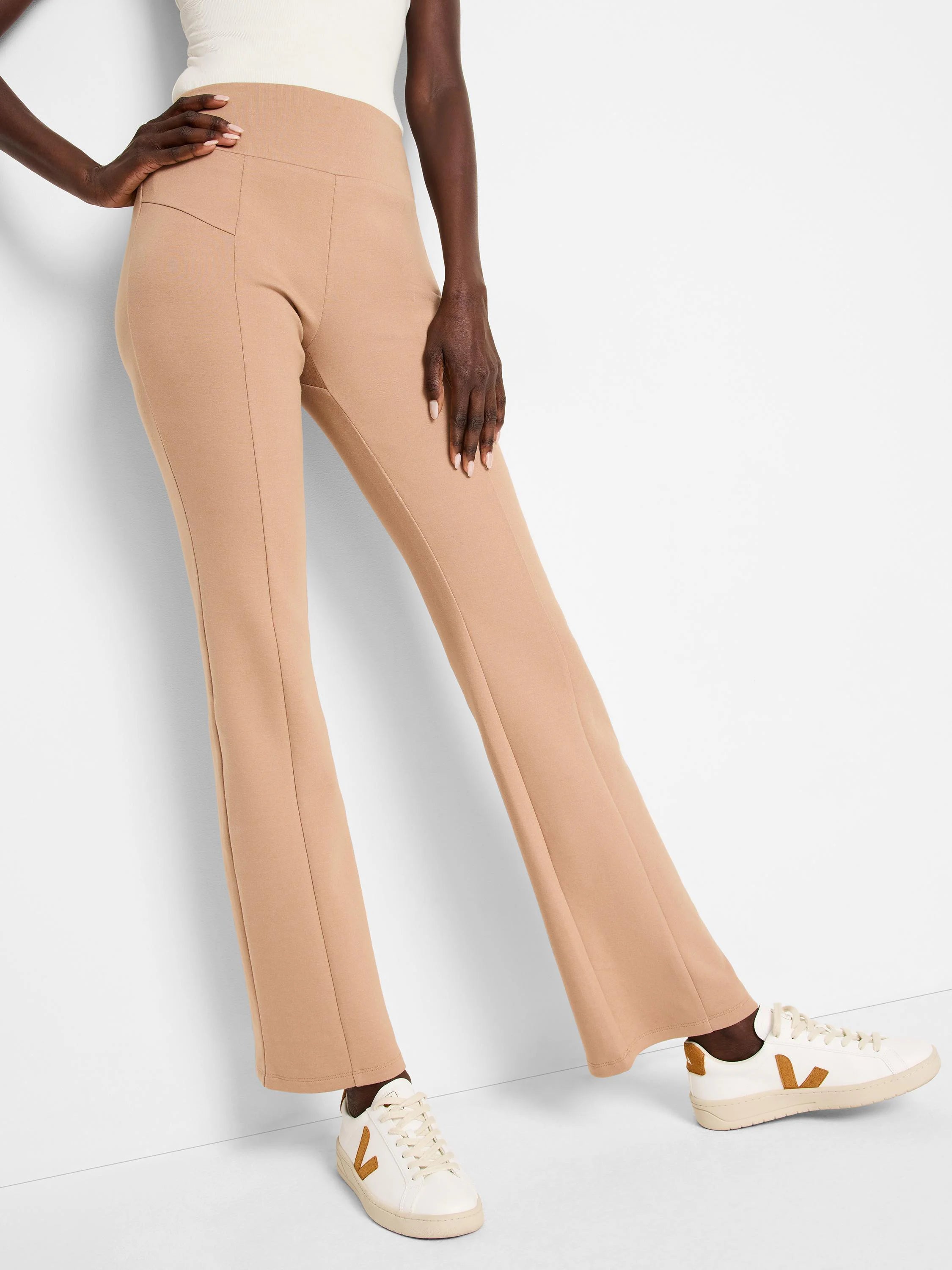 Light brown bootcut pants with center seams.  High-waisted.