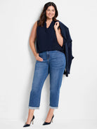 Navy blue sleeveless tank with ruffles around the V-neck.