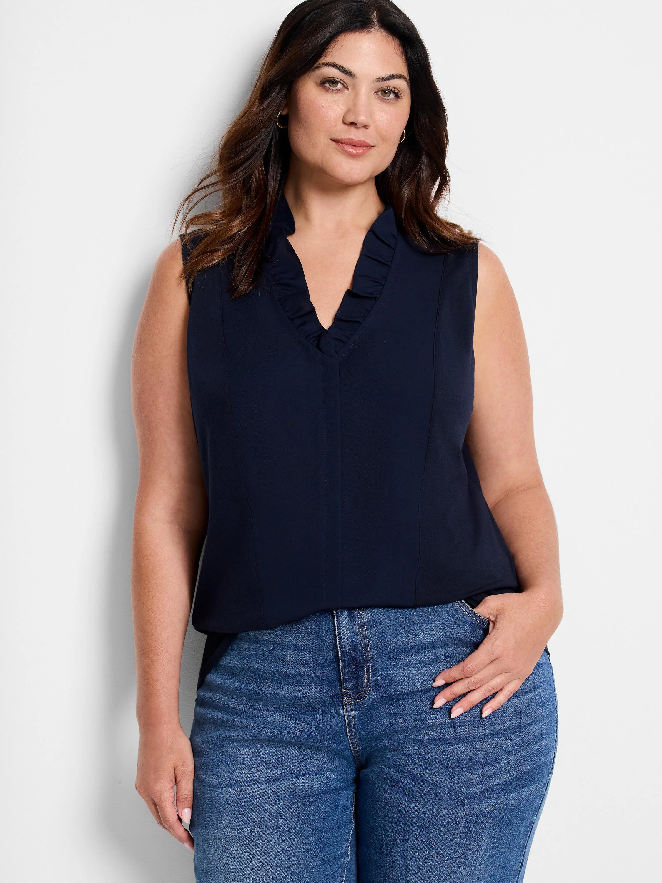 Navy sleeveless tank with a ruffled V-neckline.