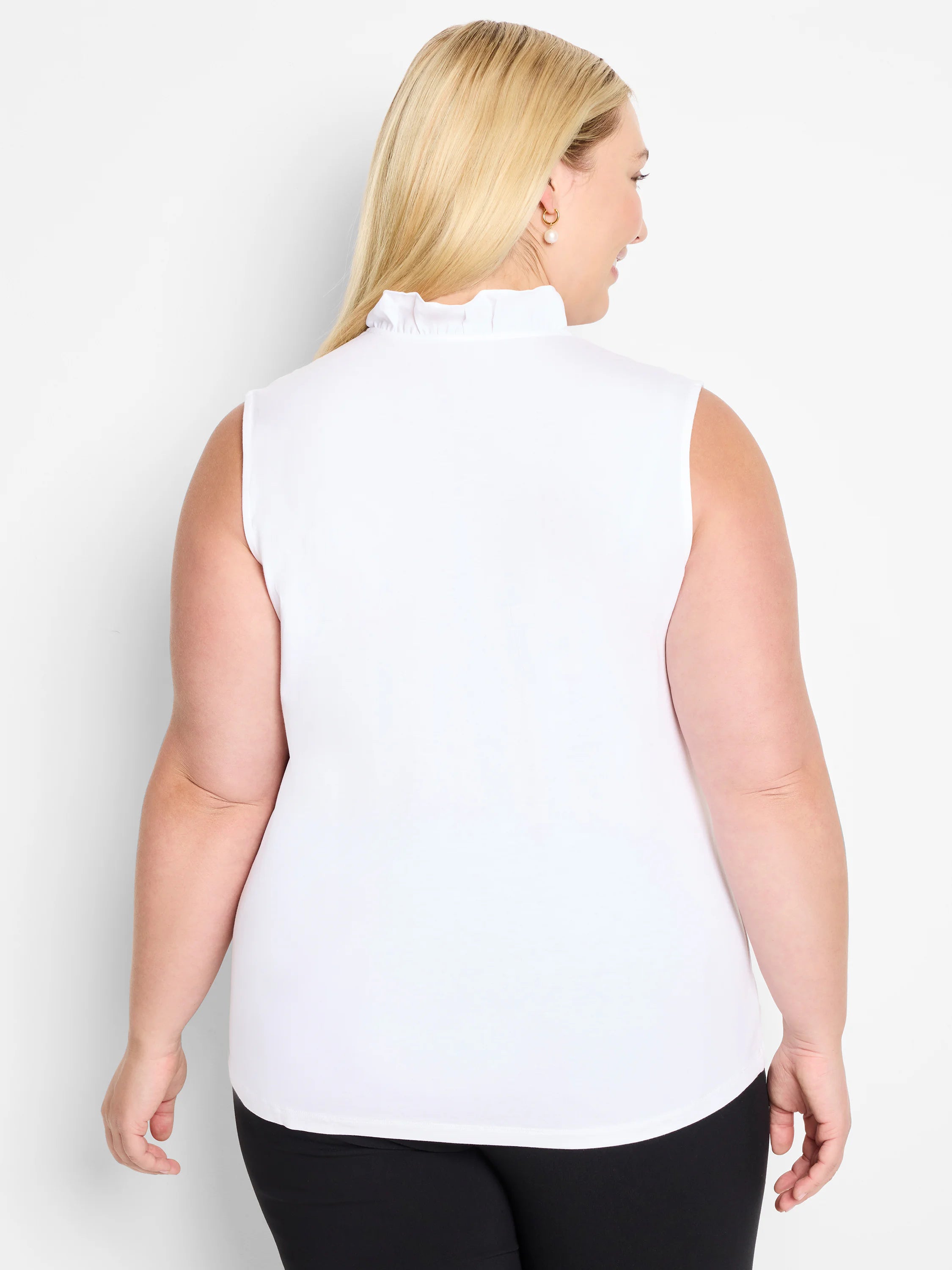 White sleeveless tank top with a ruffled mock neck, shown from the back on a model.