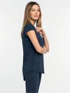 Navy blue, loose-fit tee with a rounded neck, short sleeves, and a curved hem.