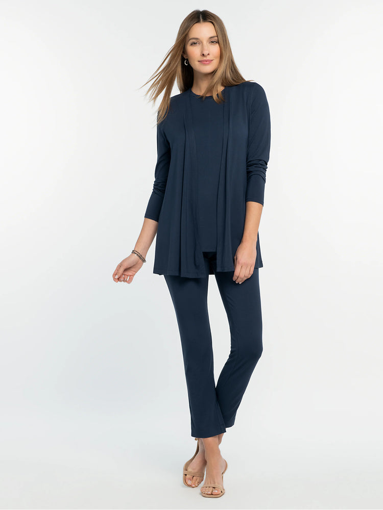 Navy blue long-sleeved crew neck tee, worn under an open matching cardigan; full outfit is navy blue.