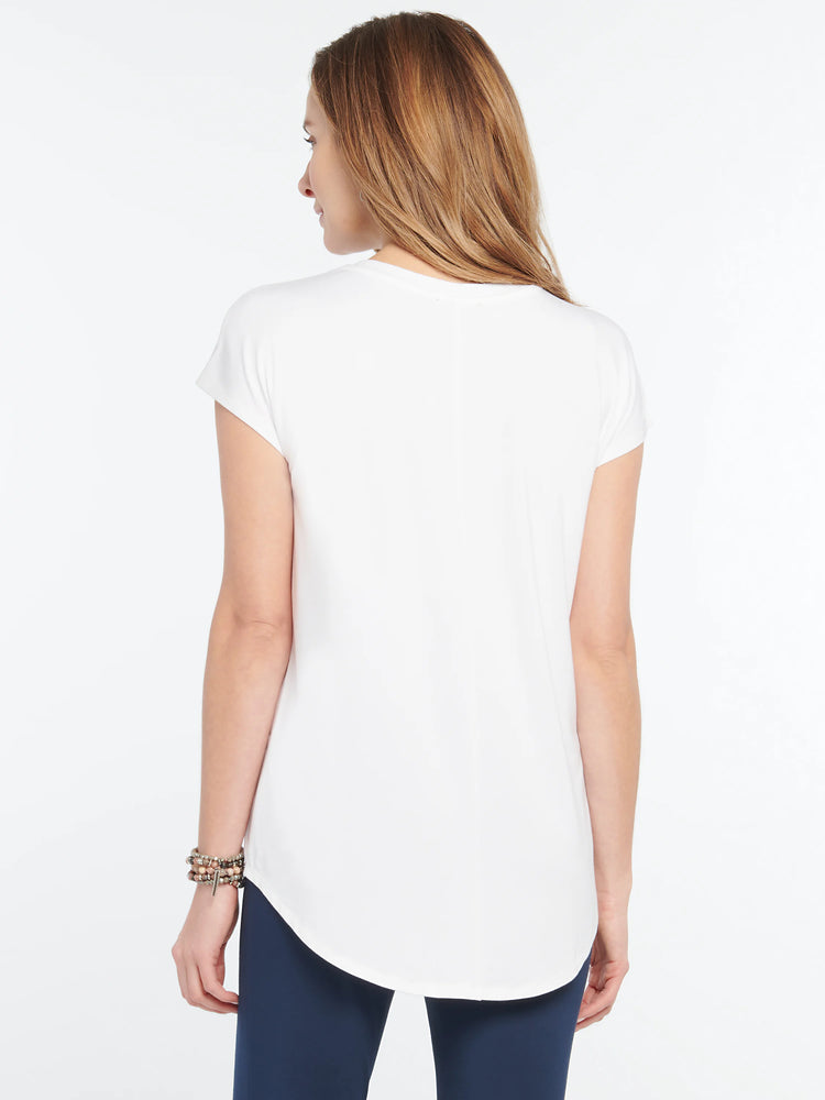 White short-sleeved tee with a rounded hem, shown from the back on a model wearing dark blue pants.