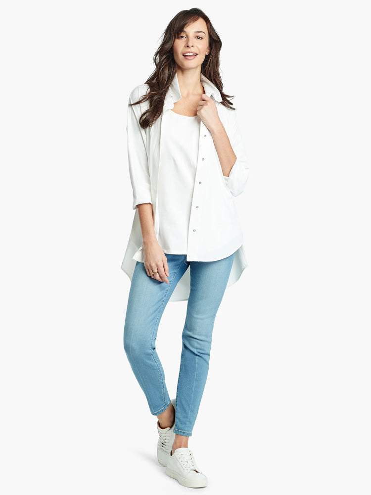 White sleeveless U-neck tank top with a rounded shirt tail hem.