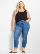 Black relaxed fit scoop neck tank top on a model.