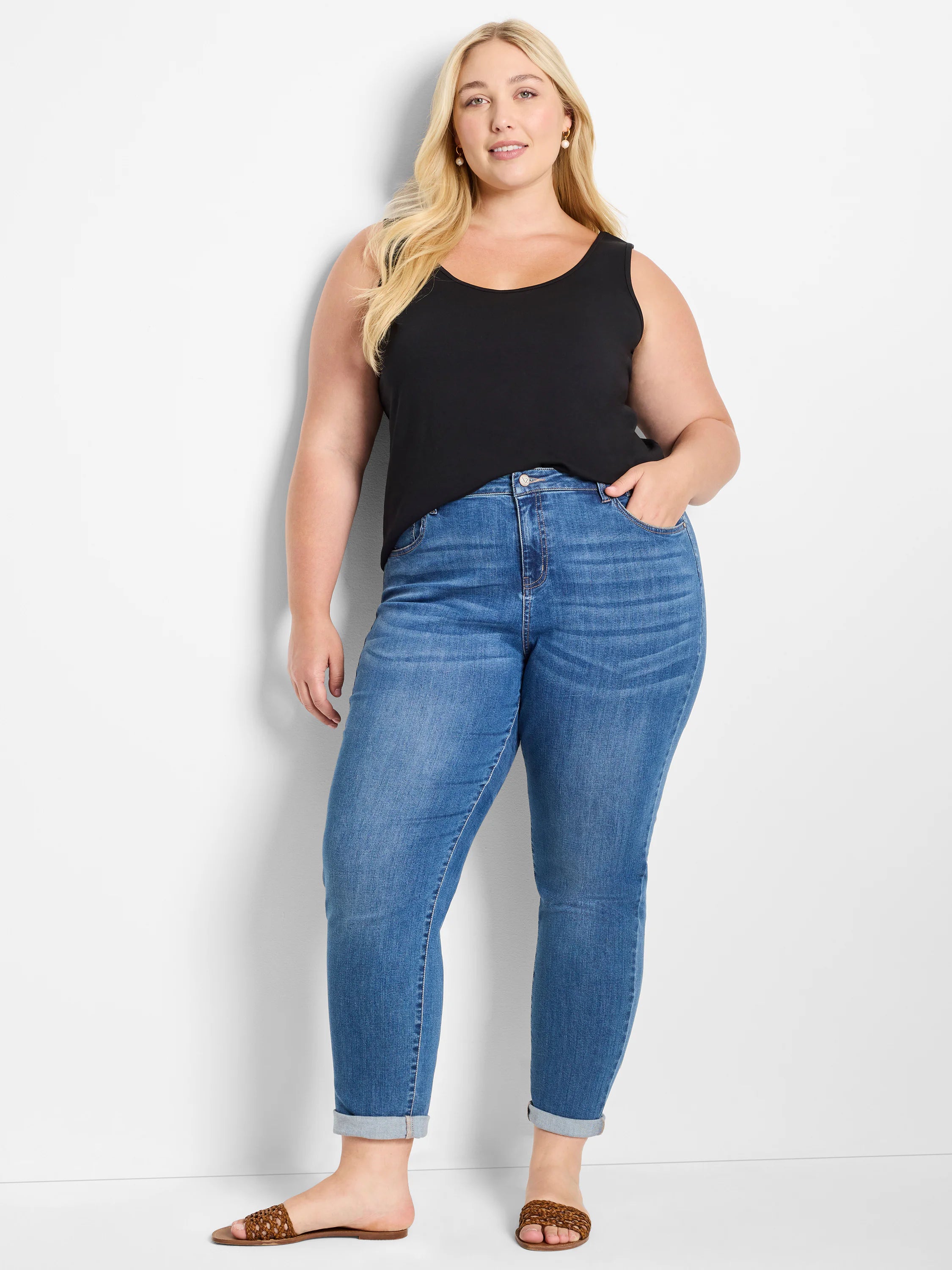 Black relaxed fit scoop neck tank top on a model.