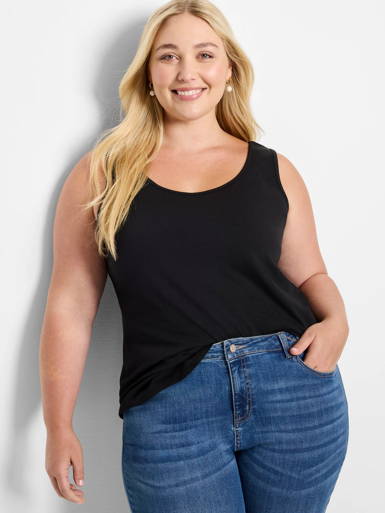 Black sleeveless scoop neck tank top with a shirt tail hem, worn by a woman.